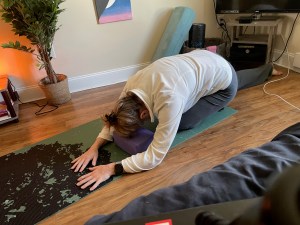 Demonstrating block for child's pose