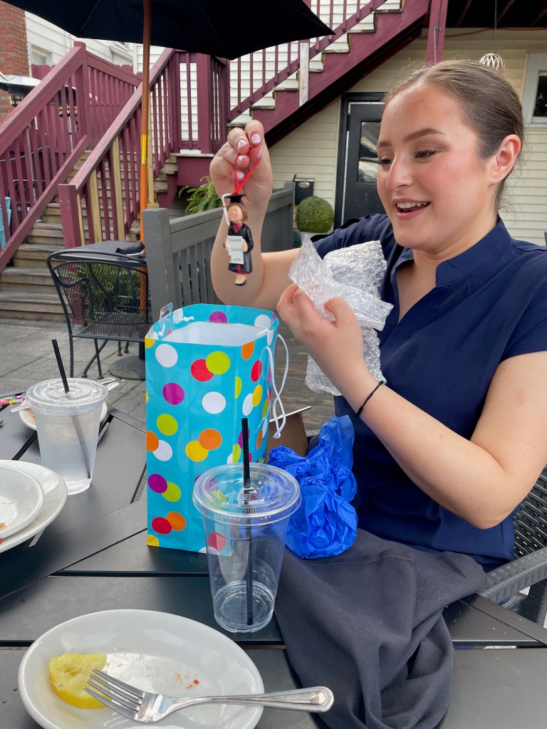 My daughter opening her graduation ornament