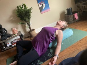 Sivasana with bolster under back