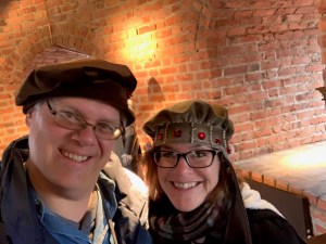 Wearing old fashioned hats